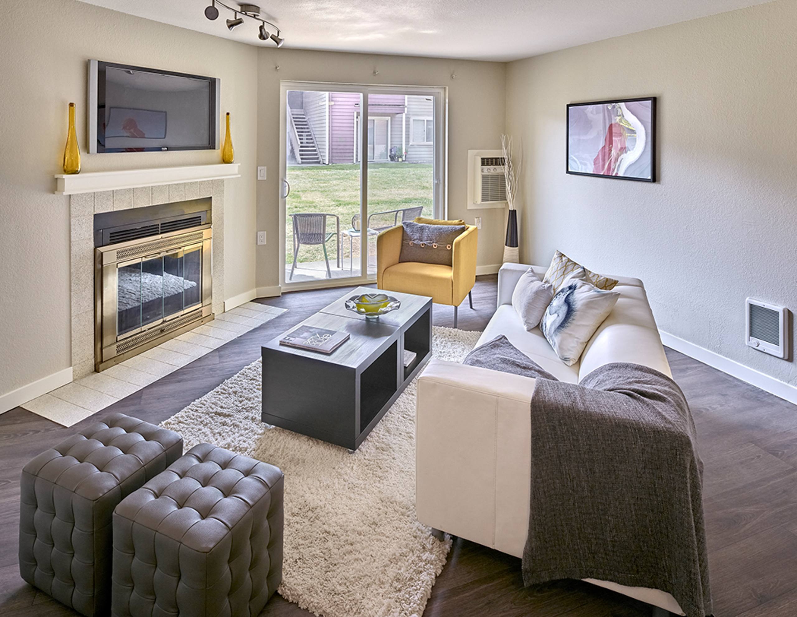 a living room with a fireplace and a couch